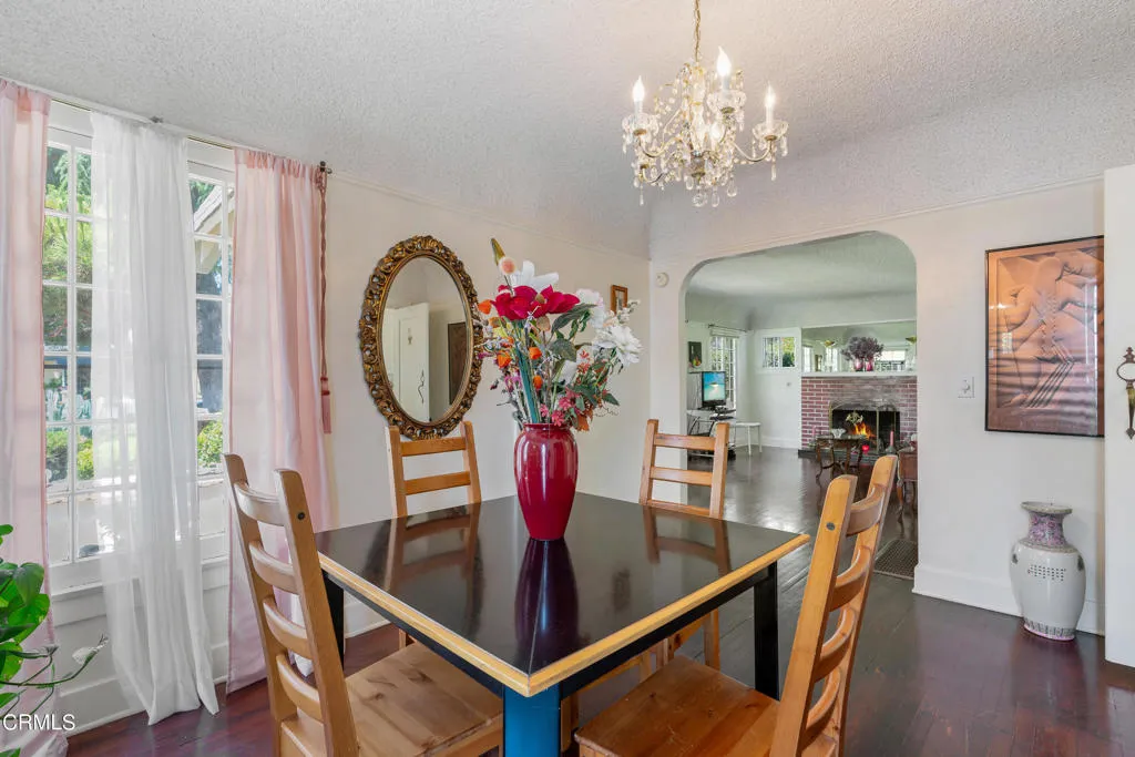 2122 Navarro Avenue Altadena, CA 91001 - Photo 15 of 40 a view of a dining room with furniture a chandelier and wooden floor