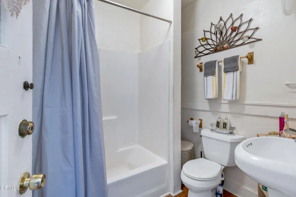 2122 Navarro Avenue Altadena, CA 91001 - Photo 18 of 40 a white toilet sitting next to a bathroom sink