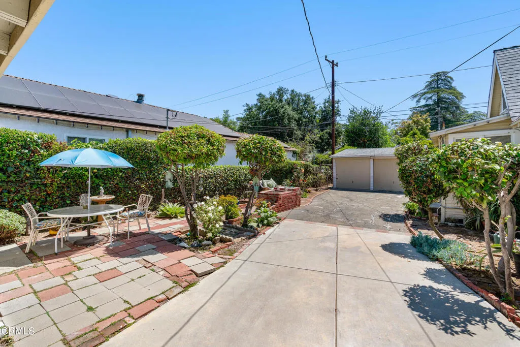 2122 Navarro Avenue Altadena, CA 91001 - Photo 22 of 40 a view of a patio with table and chairs under an umbrella