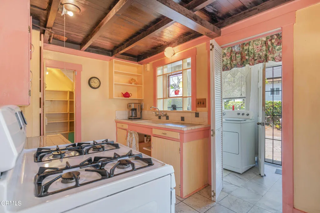 2122 Navarro Avenue Altadena, CA 91001 - Photo 25 of 40 a kitchen with a stove and a refrigerator