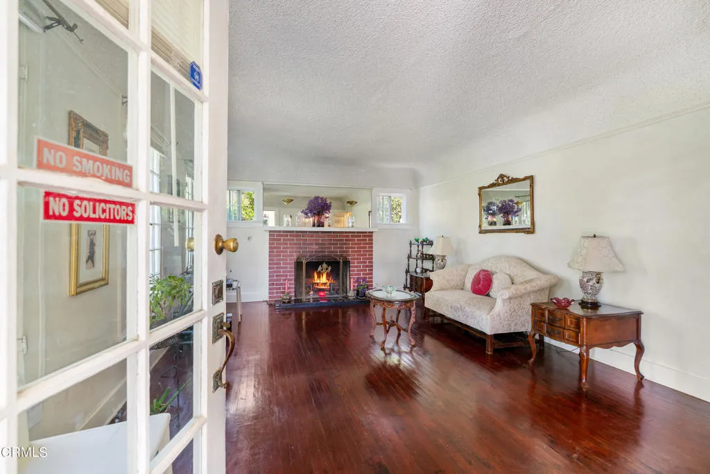 2122 Navarro Avenue Altadena, CA 91001 - Photo 6 of 40 a living room with furniture and a fireplace