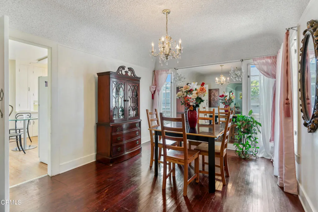 2122 Navarro Avenue Altadena, CA 91001 - Photo 7 of 40 a view of a dining room with furniture wooden floor and chandelier