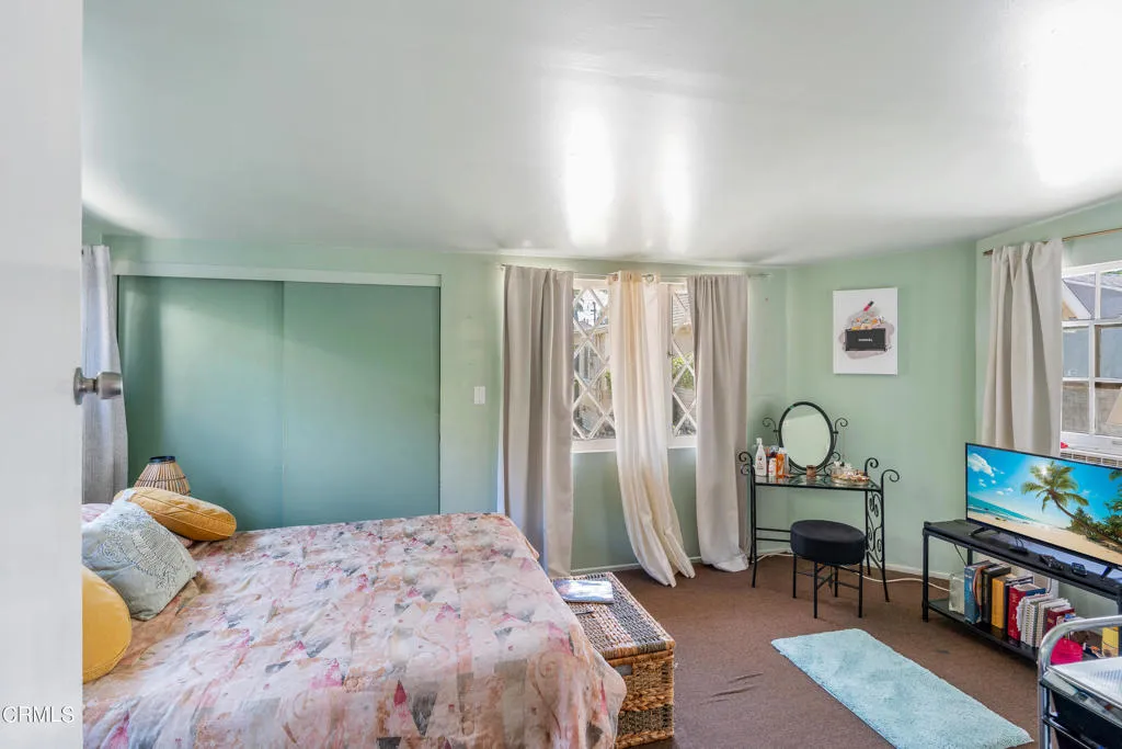 2122 Navarro Avenue Altadena, CA 91001 - Photo 10 of 40 a bedroom with a bed and wooden floor