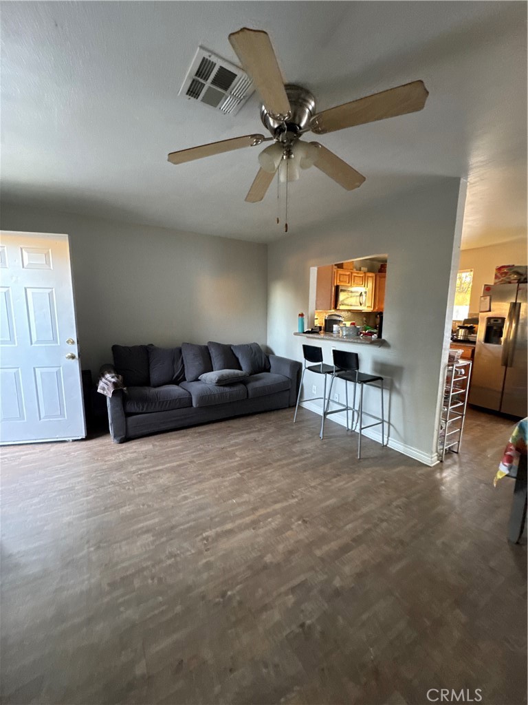 4438 Park Avenue Riverside, CA 92507 - Photo 12 of 23 a living room with furniture and a flat screen tv