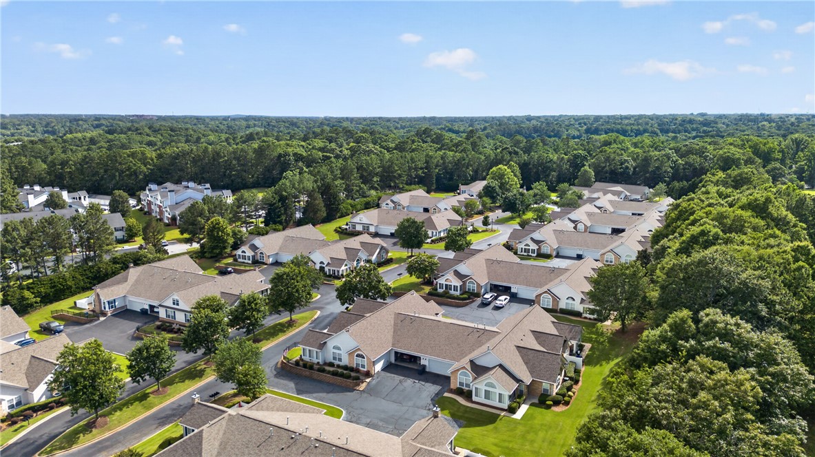 134 Life Style Lane Anderson, SC 29621 - Photo 39 of 44 An aerial perspective reveals a charming residential community nestled amongst lush, mature trees, offering peaceful living.