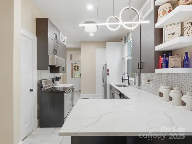 a kitchen with a sink a stove and refrigerator