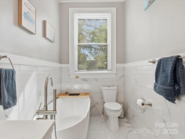 a bathroom with a shower sink and mirror