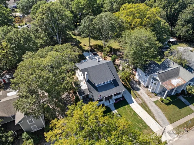 an aerial view of a house with a garden