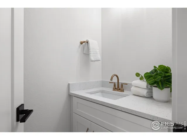 a bathroom with a sink a vanity and a mirror