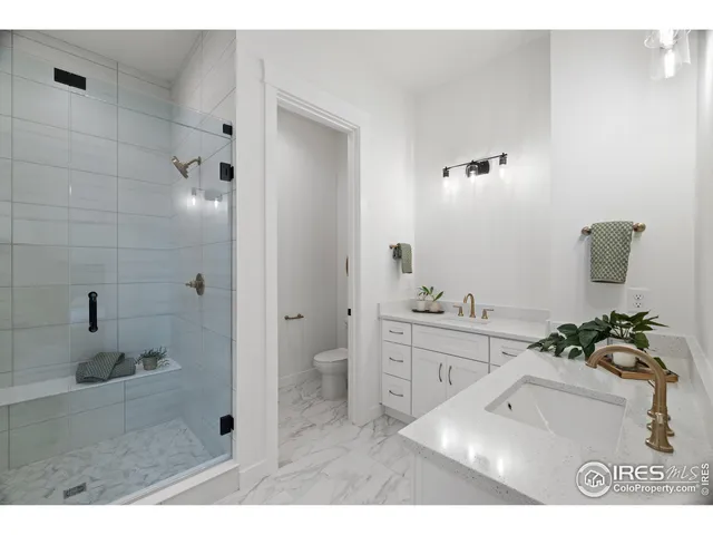 a bathroom with a sink a shower and a mirror