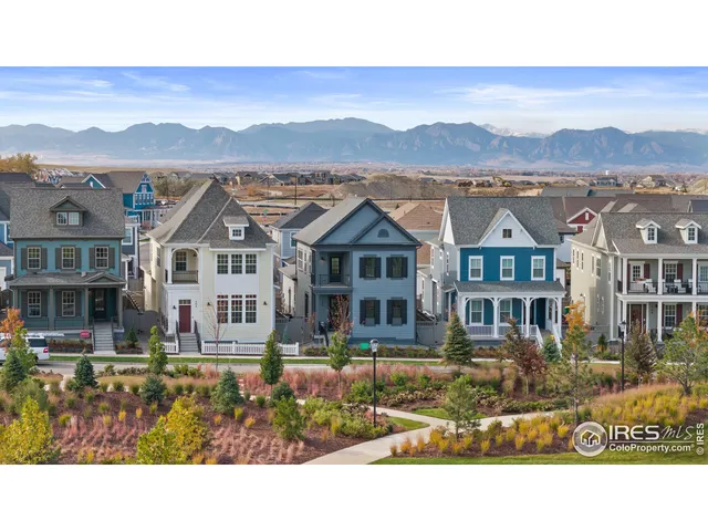 a view of a city with lawn chairs