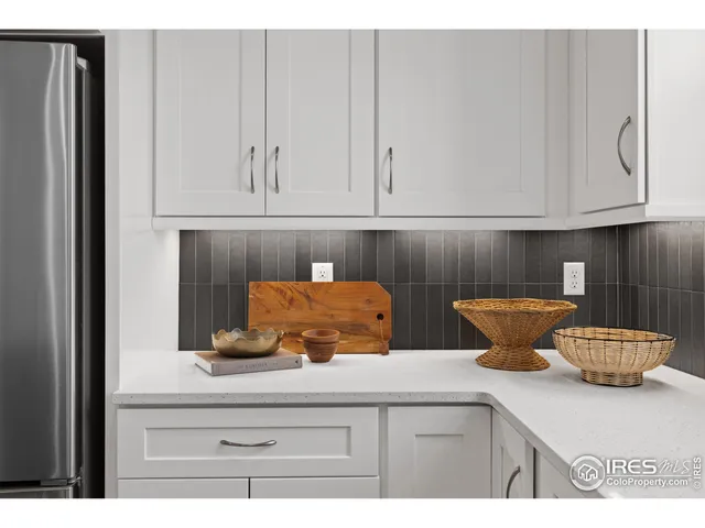 a kitchen with a stove and cabinets