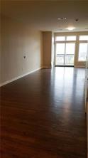 1655 Fifth Avenue, Unit 502 Pittsburgh, PA 15219 - Photo 18 of 22 a view of empty room with wooden floor and fan