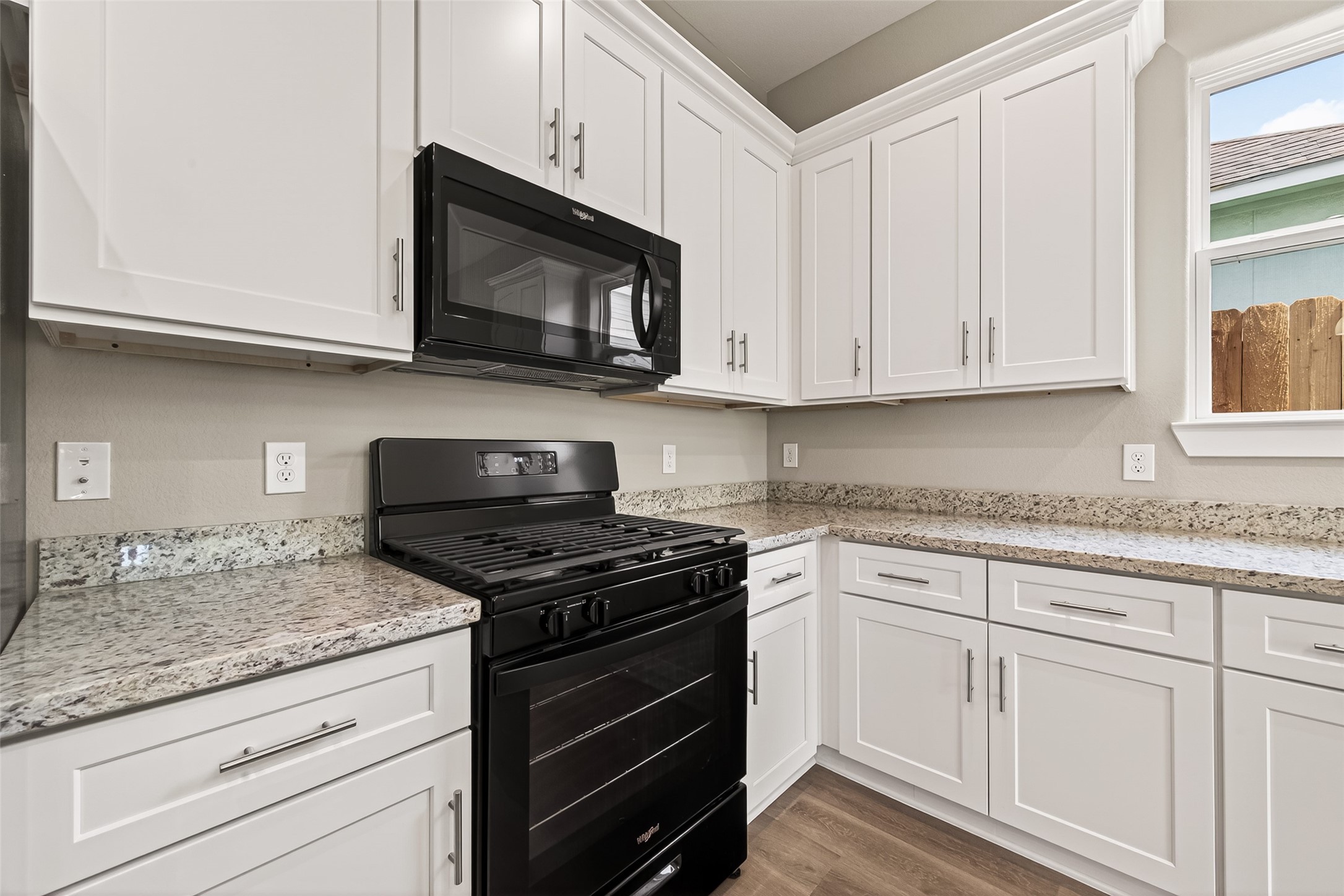 3514 Runnels Street, Unit B Houston, TX 77003 - Photo 7 of 39 Here's a closer look at this fresh kitchen. Granite countertops over white shaker-style cabinets. The new appliances complement the granite countertops.