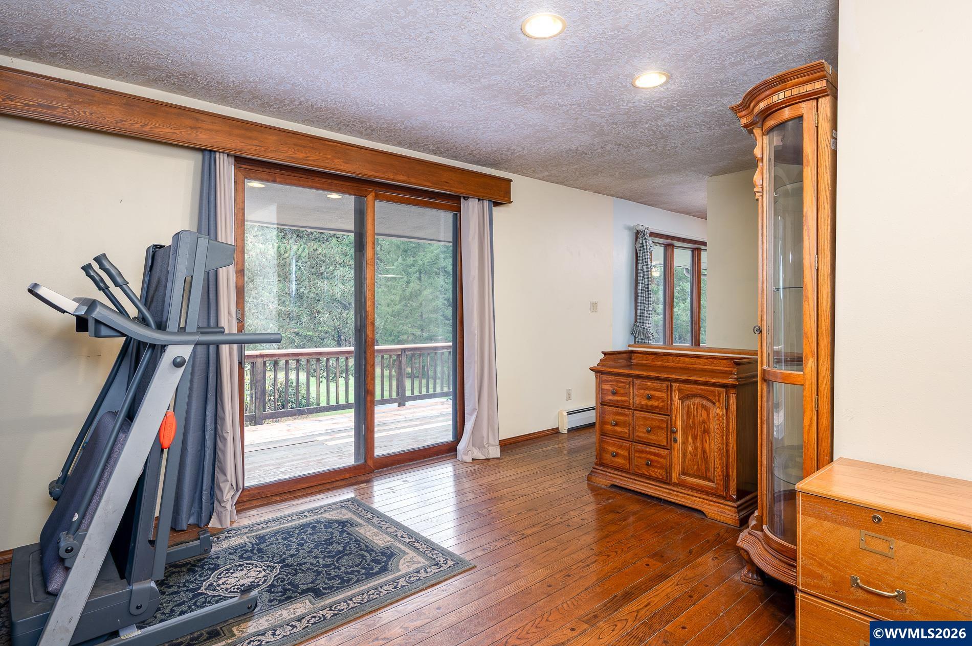 27572 South Kinzy Road Estacada, OR 97023 - Photo 19 of 50 a view of a hallway with wooden floor and windows