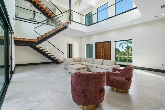 a bedroom with a large bed and a large window