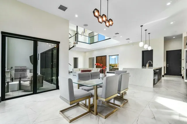 a bathroom with a toilet sink vanity and mirror