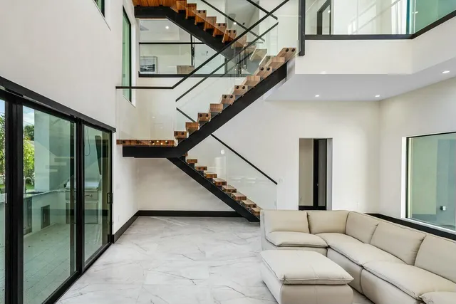 a view of a livingroom with furniture and a backyard