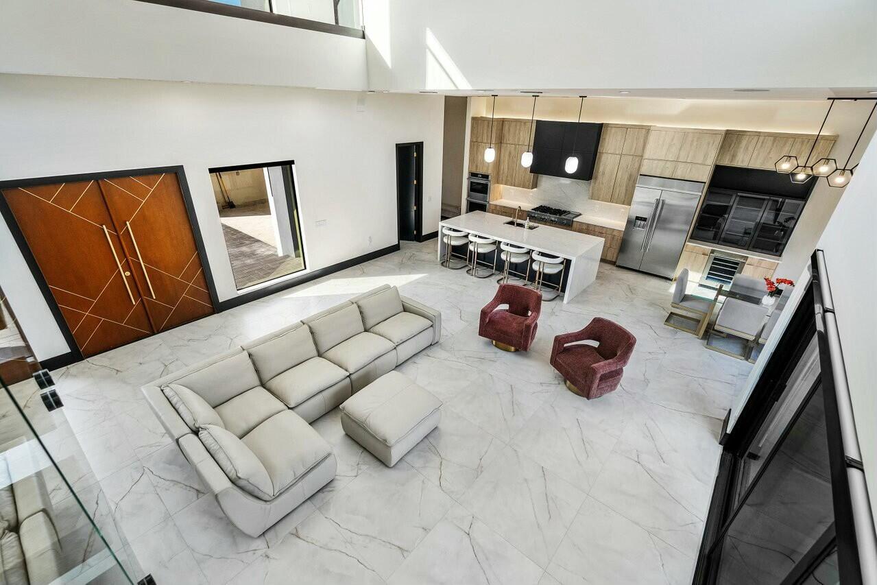 13480 Highway 1 Juno Beach, FL 33408 - Photo 20 of 90 a room with furniture a flat screen tv and a window