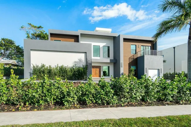 a dining room with furniture and a floor to ceiling window