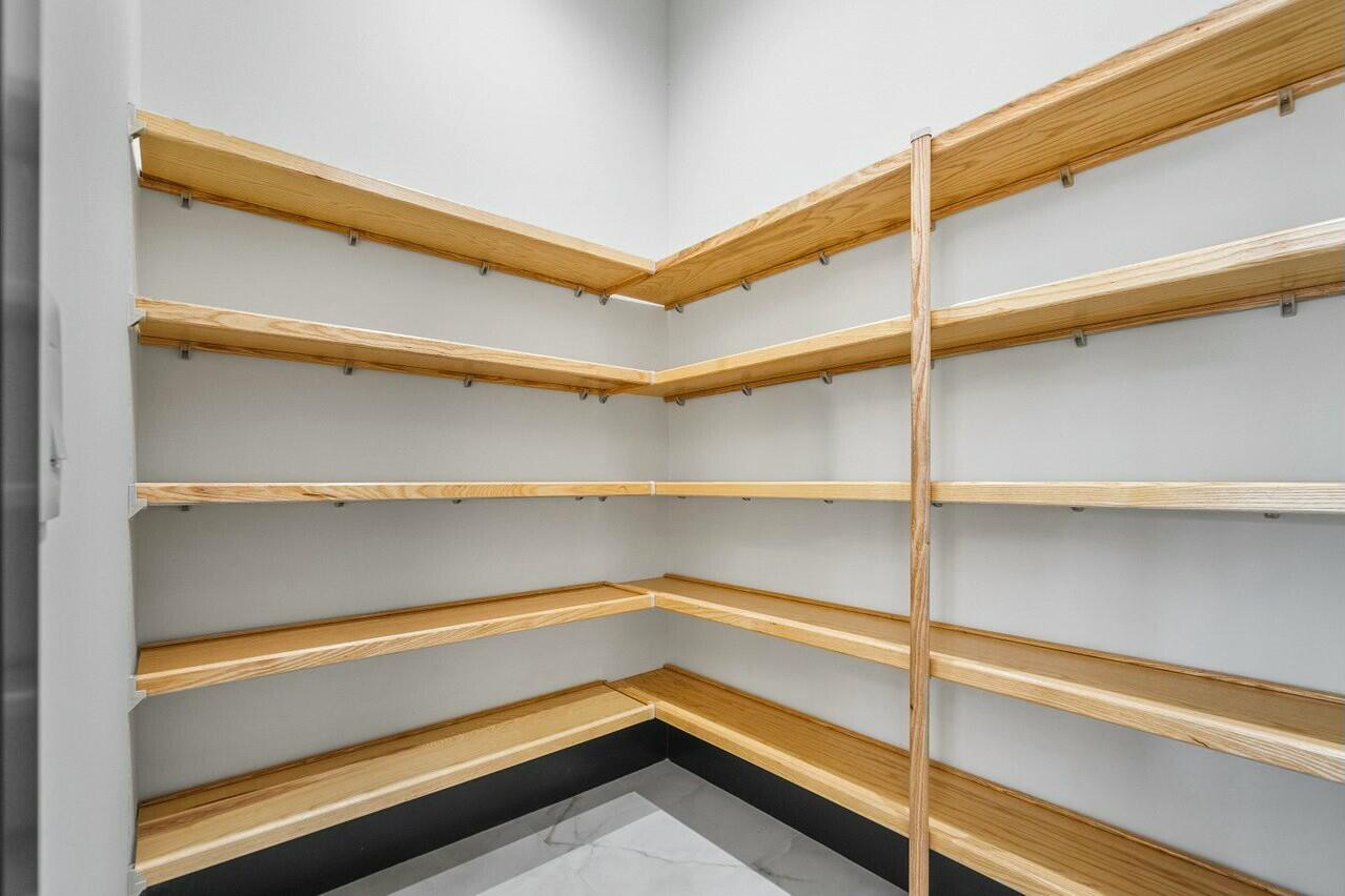 13480 Highway 1 Juno Beach, FL 33408 - Photo 22 of 90 a view of walk in closet with empty racks