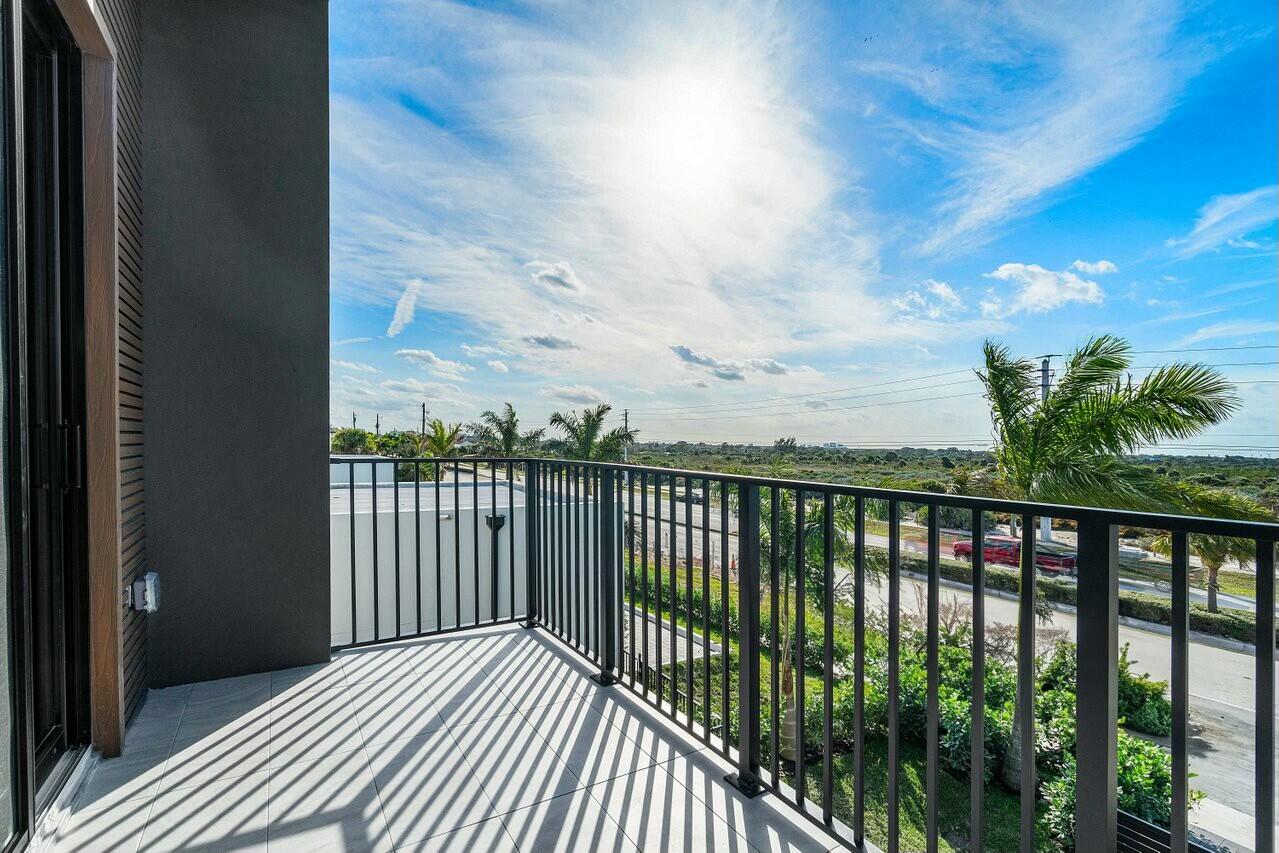 13480 Highway 1 Juno Beach, FL 33408 - Photo 46 of 90 a view of a balcony with wooden floor