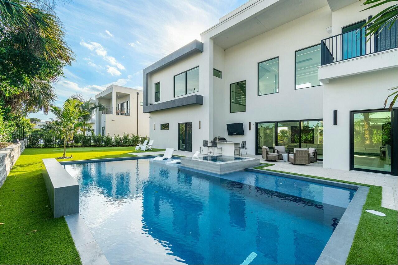 13480 Highway 1 Juno Beach, FL 33408 - Photo 60 of 90 a view of swimming pool with outdoor seating and a yard