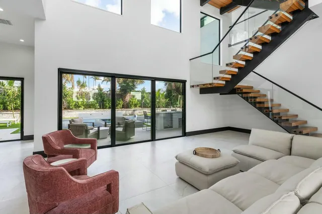 a bathroom with a granite countertop sink mirror and a shower