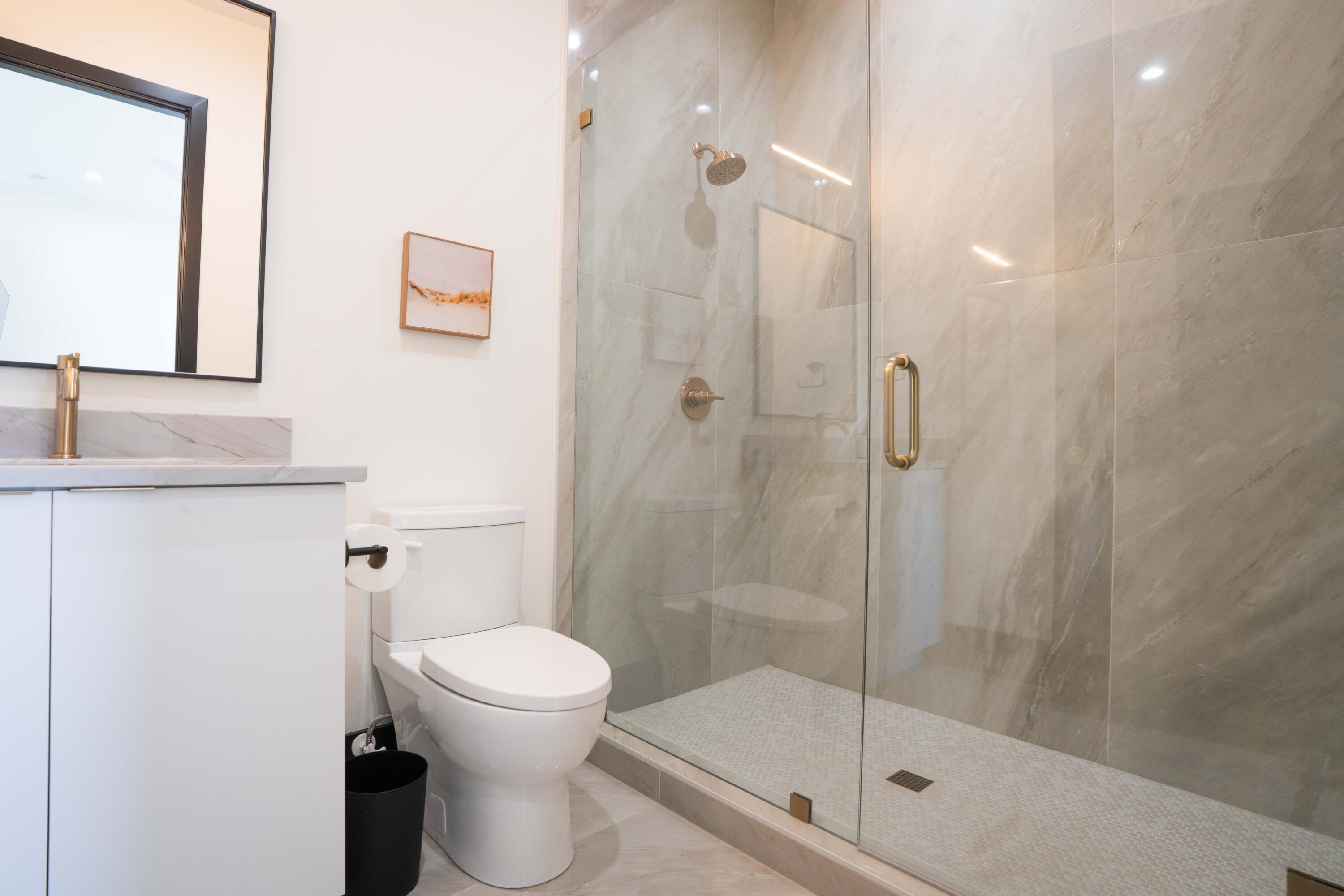 13480 Highway 1 Juno Beach, FL 33408 - Photo 89 of 90 a bathroom with a shower a toilet and a sink