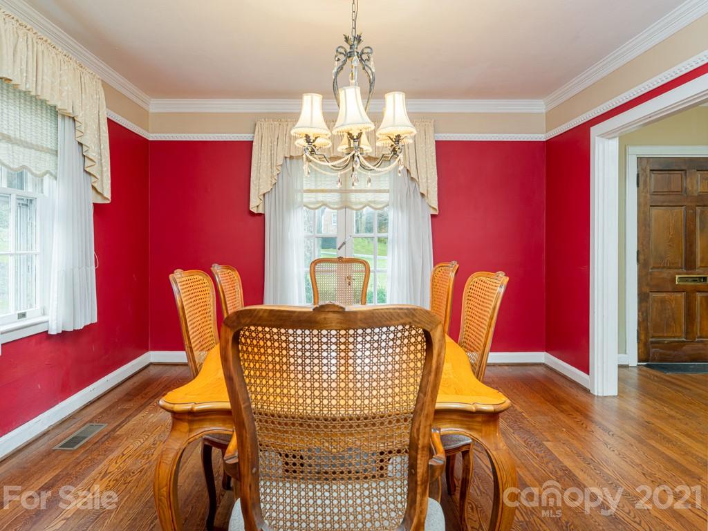 11 Hilltop Road Asheville, NC 28803 - Photo 13 of 42 a view of a dining room with furniture and chandelier