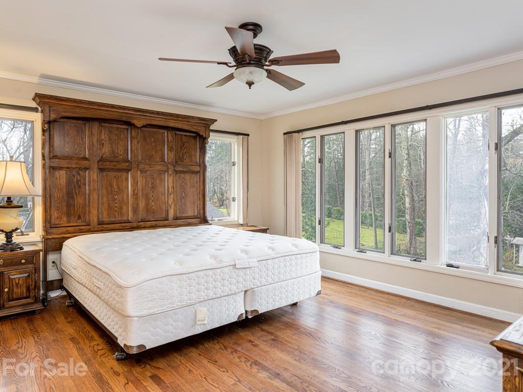 11 Hilltop Road Asheville, NC 28803 - Photo 20 of 42 a bedroom with a large bed and a large window