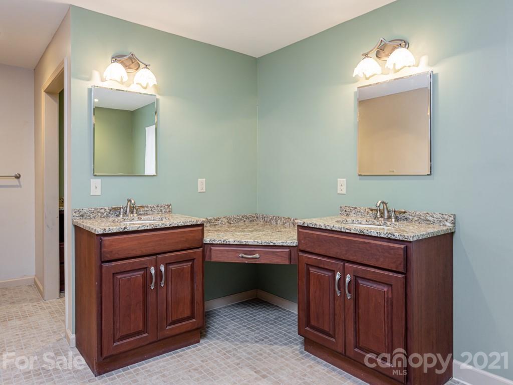 11 Hilltop Road Asheville, NC 28803 - Photo 22 of 42 a bathroom with a sink and a mirror