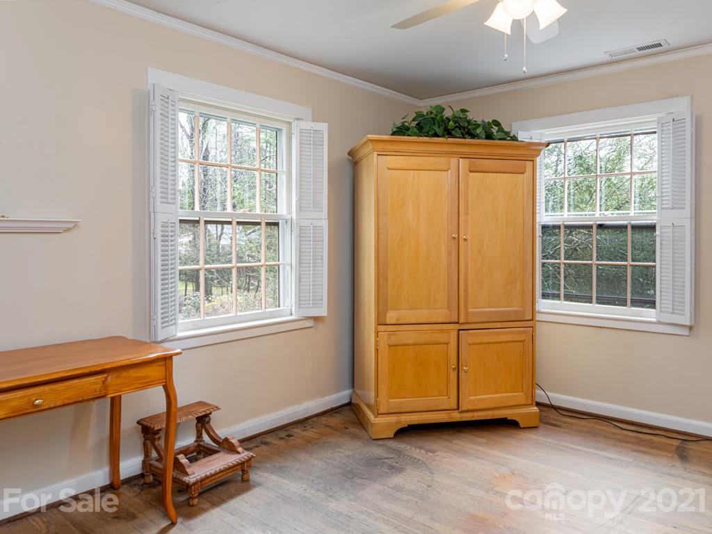 11 Hilltop Road Asheville, NC 28803 - Photo 27 of 42 a view of a room with gym equipment and a window