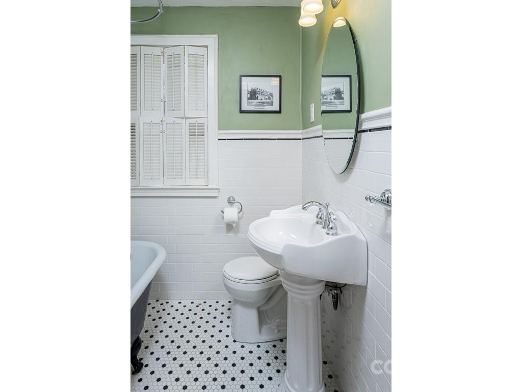 11 Hilltop Road Asheville, NC 28803 - Photo 28 of 42 a bathroom with a sink toilet and a mirror