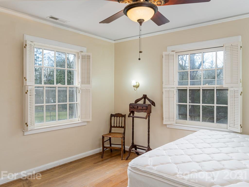 11 Hilltop Road Asheville, NC 28803 - Photo 29 of 42 a bedroom with bed and window