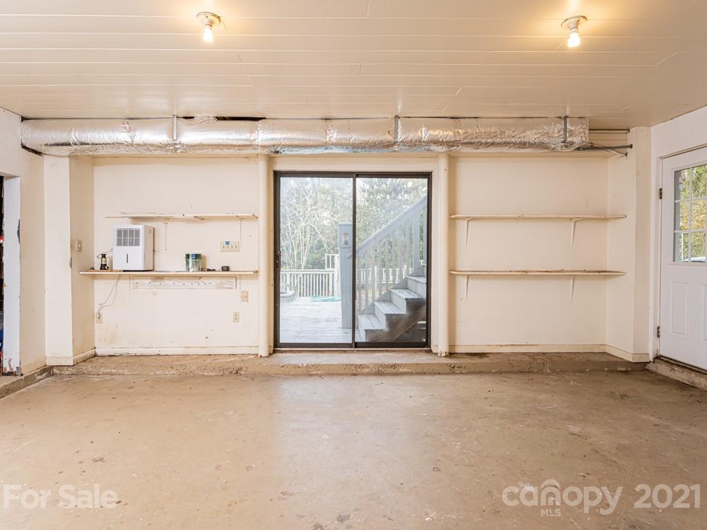11 Hilltop Road Asheville, NC 28803 - Photo 34 of 42 a view of a room with cabinet and mirrors