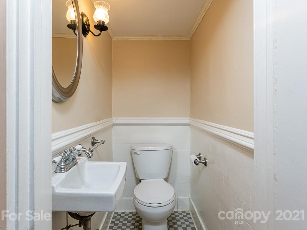 11 Hilltop Road Asheville, NC 28803 - Photo 37 of 42 a bathroom with a toilet and a sink