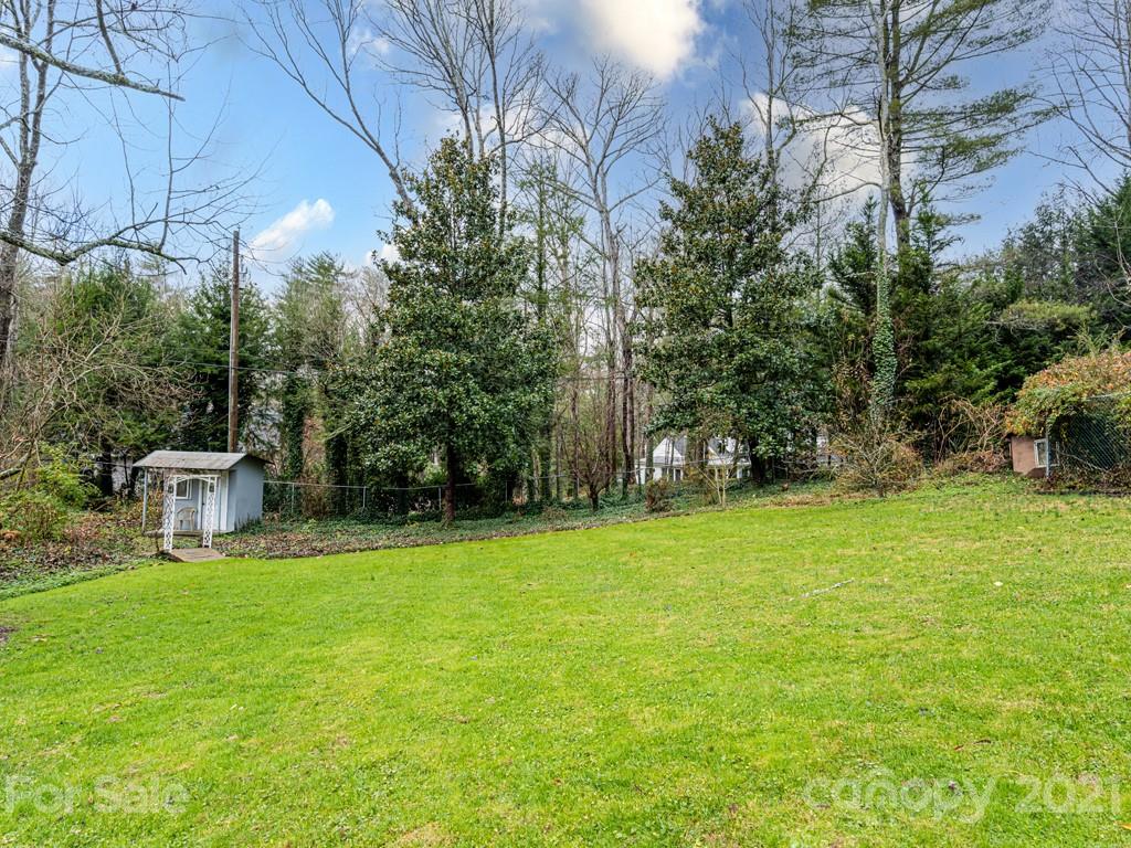 11 Hilltop Road Asheville, NC 28803 - Photo 38 of 42 a view of a swimming pool with a patio