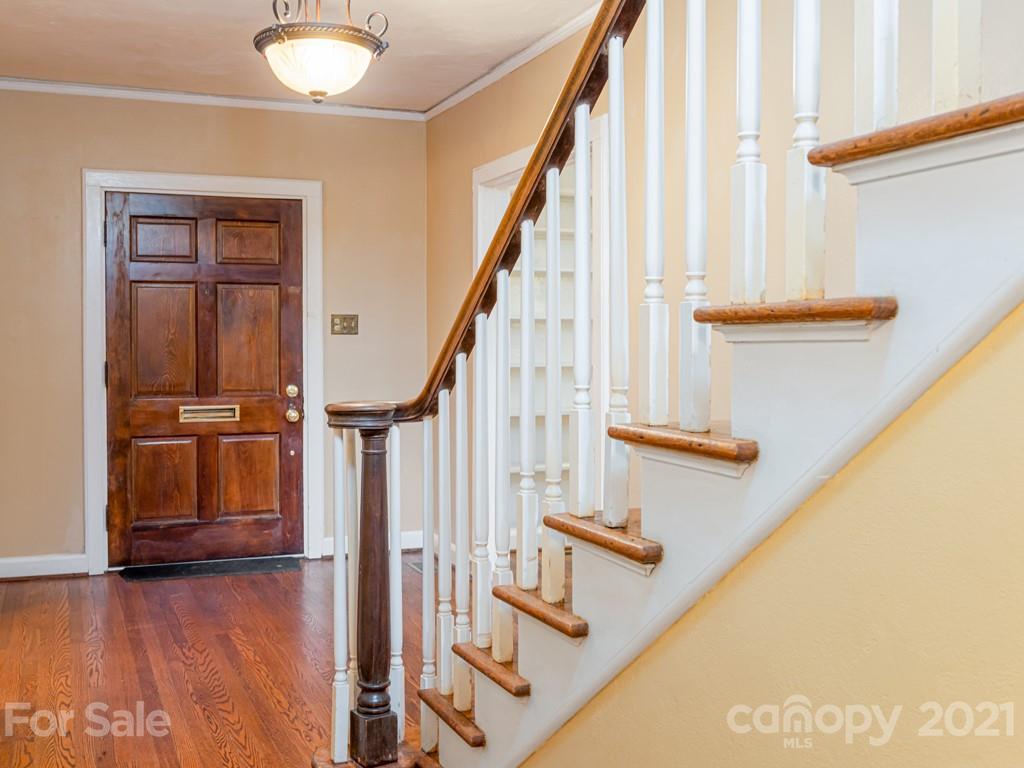 11 Hilltop Road Asheville, NC 28803 - Photo 5 of 42 a view of entryway with wooden floor and front door