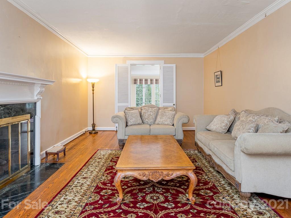11 Hilltop Road Asheville, NC 28803 - Photo 8 of 42 a living room with furniture and a rug