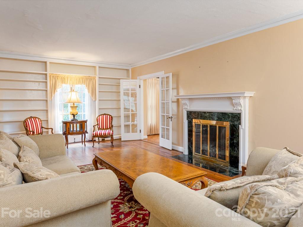 11 Hilltop Road Asheville, NC 28803 - Photo 9 of 42 a living room with furniture and a fireplace