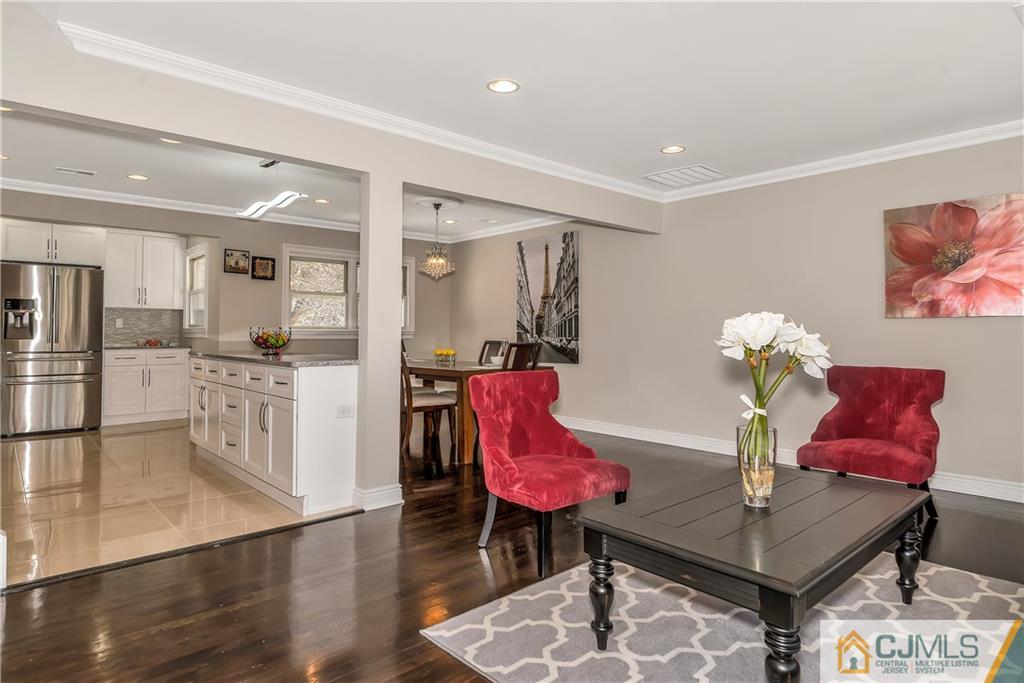 10 Jean Road East Brunswick, NJ 08816 - Photo 11 of 21 a living room with furniture and kitchen view