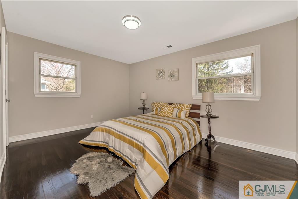 10 Jean Road East Brunswick, NJ 08816 - Photo 13 of 21 a bedroom with a bed and wooden floor