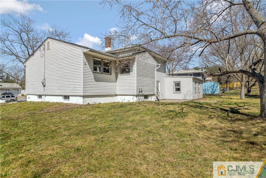 10 Jean Road East Brunswick, NJ 08816 - Photo 20 of 21 a view of a house with a yard