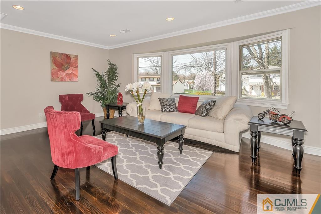 10 Jean Road East Brunswick, NJ 08816 - Photo 3 of 21 a living room with furniture a rug and a large window