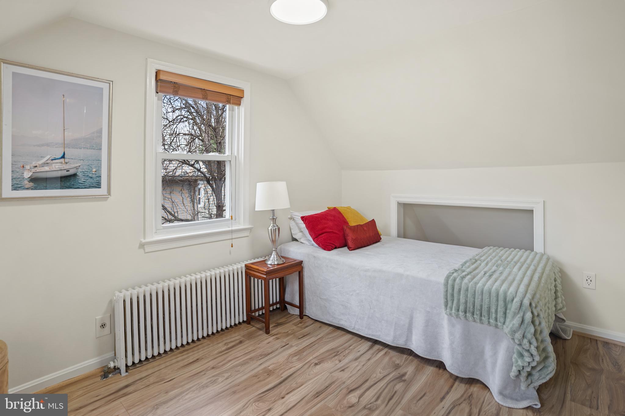 8907 Flower Avenue Silver Spring, MD 20901 - Photo 13 of 20 a bedroom with a bed and a window