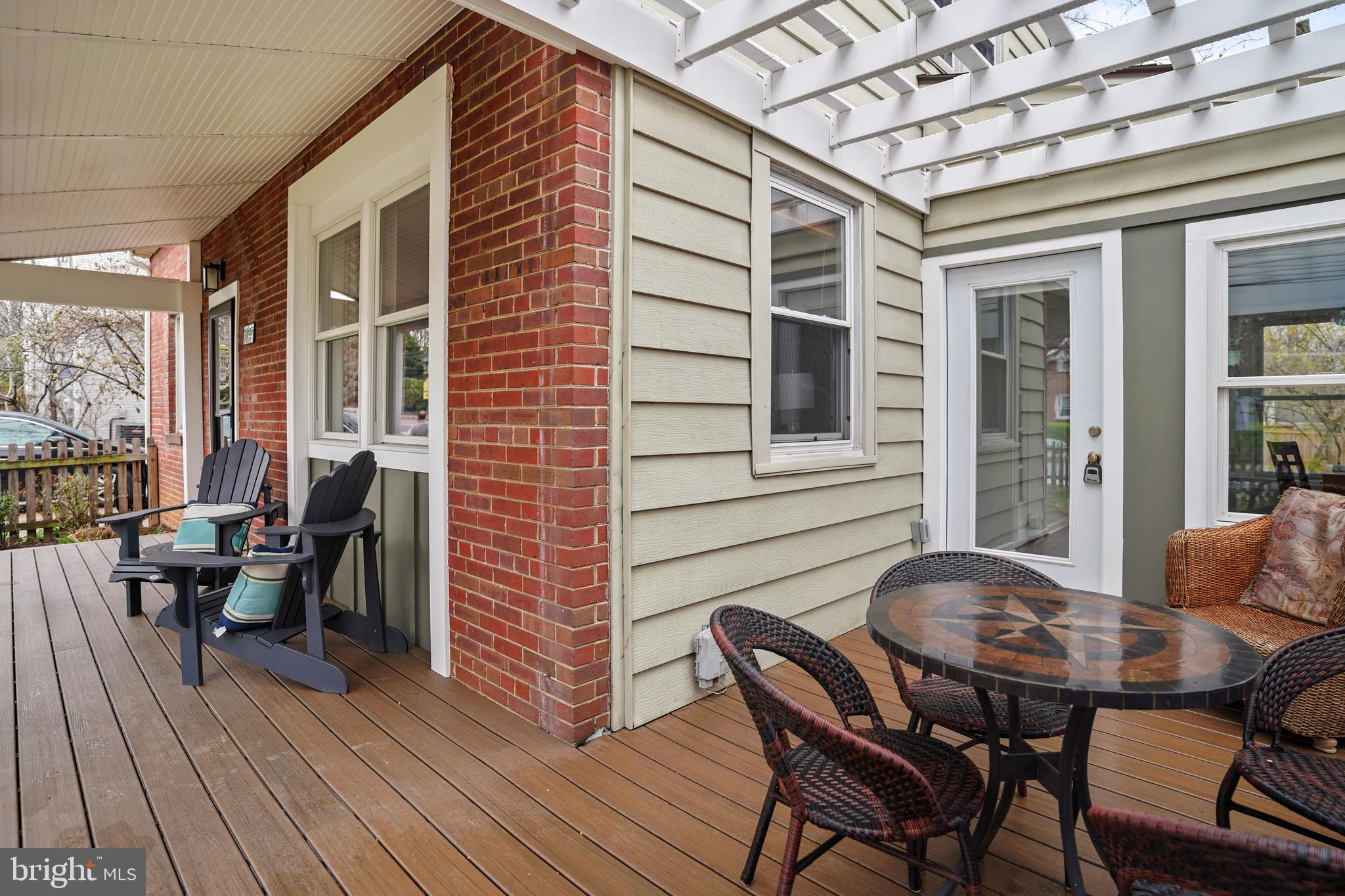 8907 Flower Avenue Silver Spring, MD 20901 - Photo 18 of 20 a balcony view with a dining table and chairs