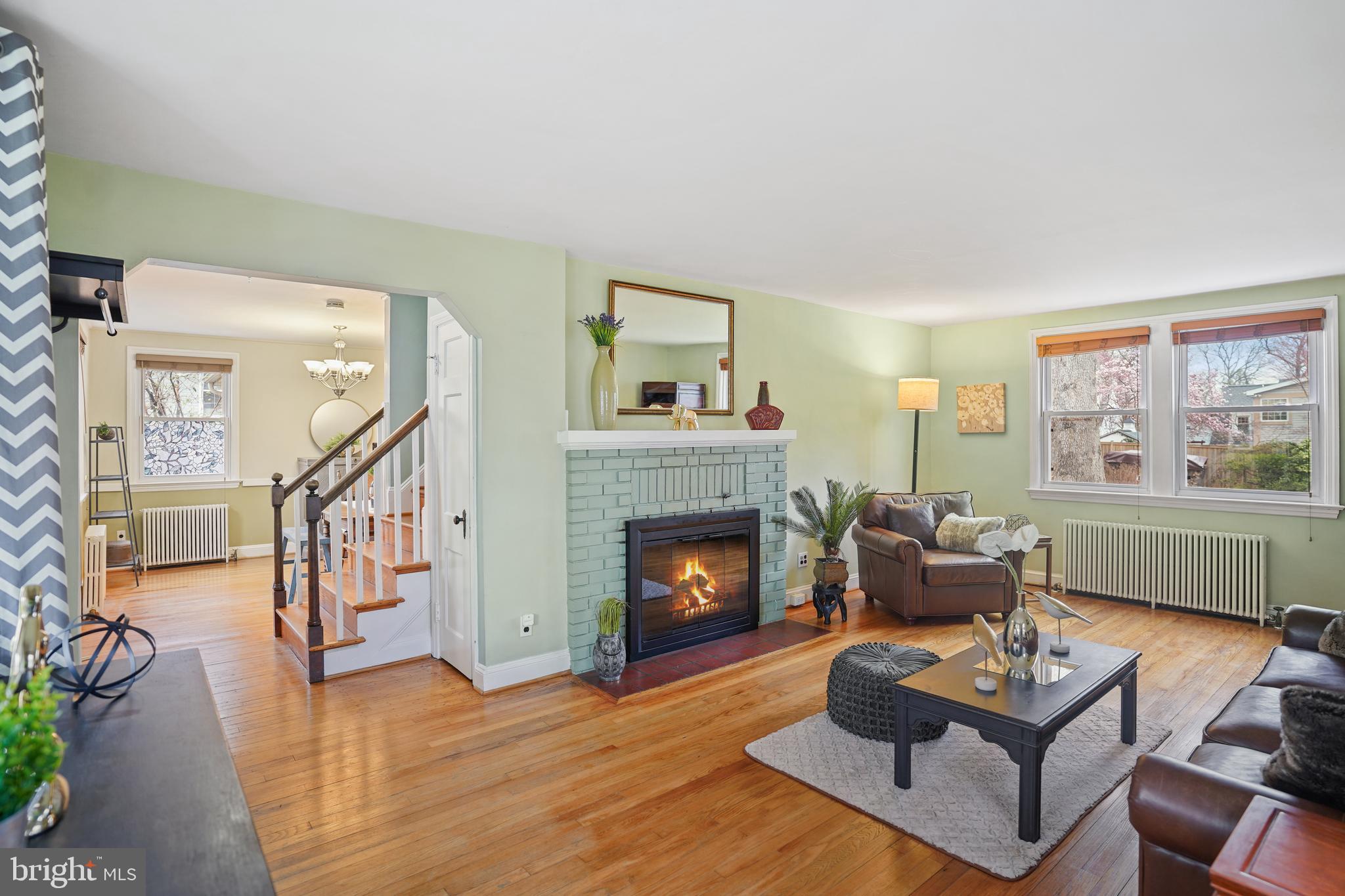8907 Flower Avenue Silver Spring, MD 20901 - Photo 2 of 20 a living room with furniture and a fireplace