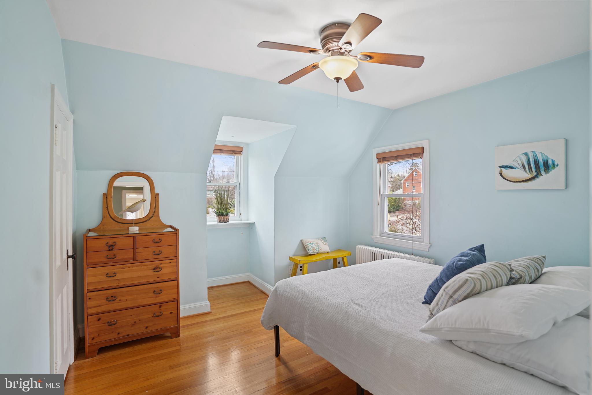 8907 Flower Avenue Silver Spring, MD 20901 - Photo 10 of 20 a bedroom with a bed and a dresser