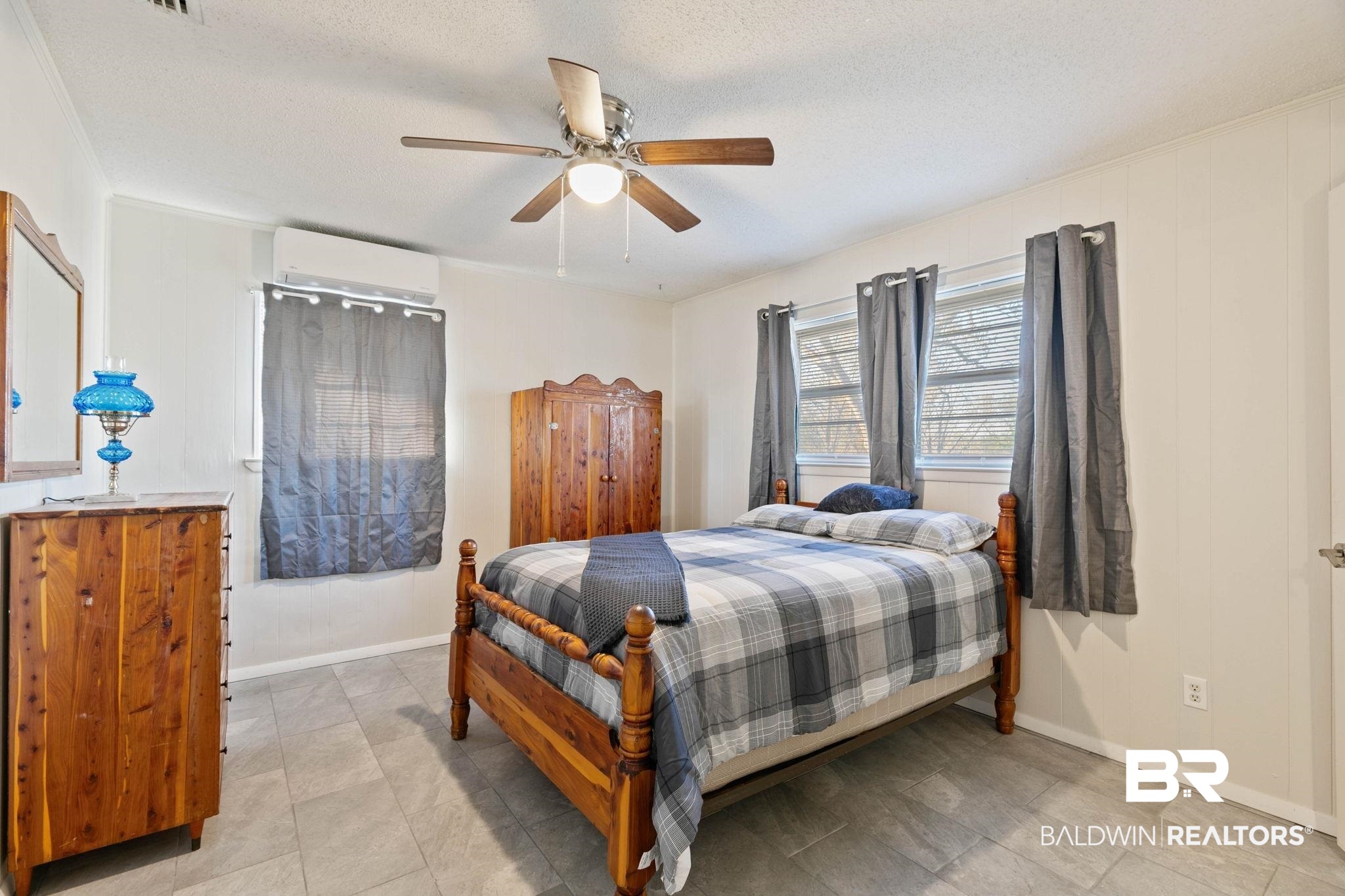 21267 Loop Road Andalusia, AL 36421 - Photo 40 of 72 Bedroom with a ceiling fan and a textured ceiling
